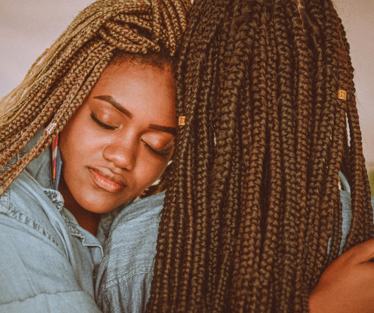 Where does the song "A Black Girl and Her Braids" originate from?